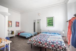 Postel nebo postele na pokoji v ubytování Ulysses in Rome