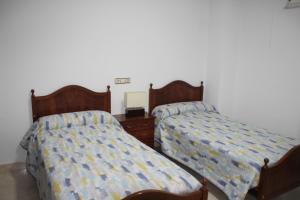 Posteľ alebo postele v izbe v ubytovaní LA CASA DEL ESTANCO