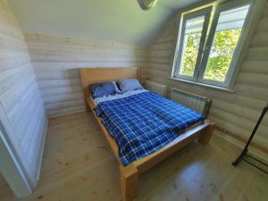 Posteľ alebo postele v izbe v ubytovaní Zielone Zagrody - Stafieje