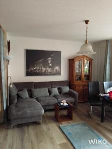 a living room with a couch and a table at Schwarzwald Anna - Lena 44 in Todtmoos