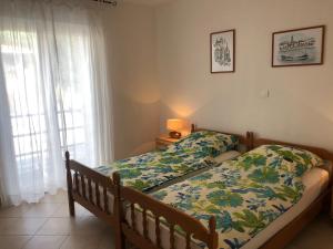 Posteľ alebo postele v izbe v ubytovaní Dalmatia Apartments