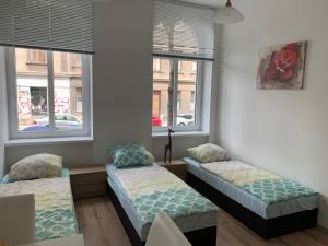 Łóżko lub łóżka w pokoju w obiekcie Raisa Apartments Lerchenfelder Gürtel 30