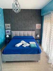 Un pat sau paturi într-o cameră la E&C Suites Roma
