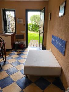 a bed in a room with a tiled floor at Residenze Maremonti in Maratea