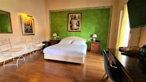Postel nebo postele na pokoji v ubytování Hotel Piazza Vecchia