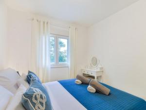 Ένα ή περισσότερα κρεβάτια σε δωμάτιο στο Apartmani Velić
