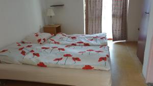 A bed or beds in a room at Aqua Hostel