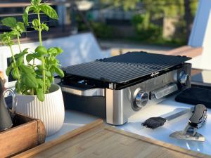 a barbecue grill sitting on top of a table at mariTIME deluxe in Portorož