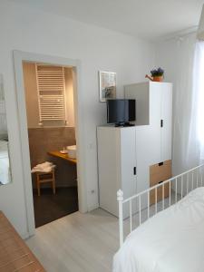TV a/nebo společenská místnost v ubytování Venice Home