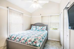 a bedroom with a bed and a ceiling fan at Duck Key Retreat Villa #5105 in Duck Key