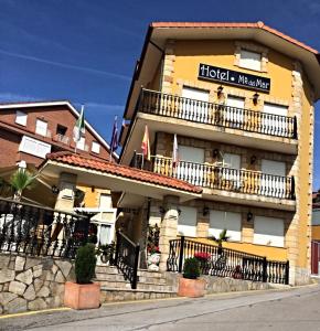 a hotel with a sign on the side of it at Hotel Maria del Mar in Noja