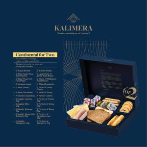 a box filled with different types of sandwiches and pastries at Amalia in Paleo Tsifliki