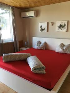 A bed or beds in a room at Nefelejcs Apartman