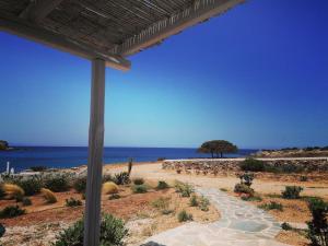 a view of the ocean from a patio at Sunset Studios & Rooms in Antiparos