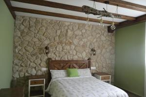 Ένα ή περισσότερα κρεβάτια σε δωμάτιο στο El Capricho de los Carrascos +74 φωτογραφίες