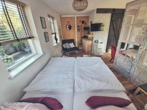 Postel nebo postele na pokoji v ubytování B&B Duinbrink