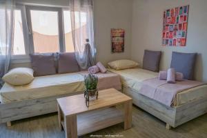 A bed or beds in a room at SUNDAY MEMORIES