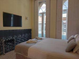 Cama ou camas em um quarto em EMAJ Boutique Hotel