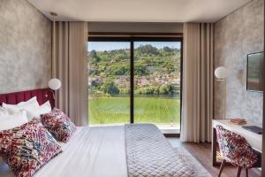 Ένα ή περισσότερα κρεβάτια σε δωμάτιο στο Quinta de Santo António - Country House & Villas