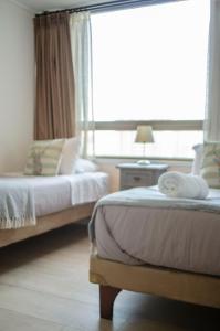 Cama o camas de una habitación en Loica Suites II