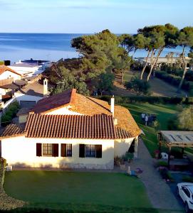 a large white house with a view of the ocean at villa Letizia in Pula