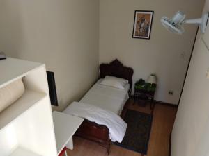 Postel nebo postele na pokoji v ubytování Hotel Cervantes