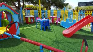 a playground with many different types of play equipment at Monopetro in Metamorfosi