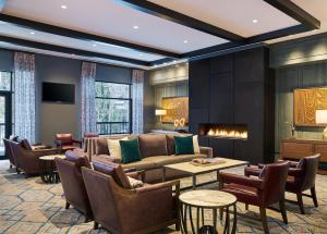 a living room with a couch and a table and chairs at Vail Residences at Cascade Village, a Destination by Hyatt Residence in Vail