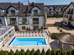 an aerial view of a house with a swimming pool at Orbisa Bis in Łeba