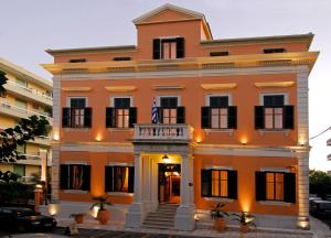 a large orange building with a balcony at Bella Venezia in Corfu