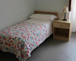 Postel nebo postele na pokoji v ubytování Hotel Villa Cecilia