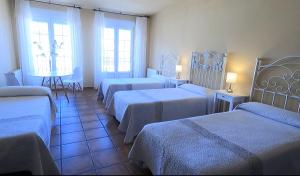 Postel nebo postele na pokoji v ubytování Hostal Santiago
