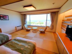 Cama ou camas em um quarto em Shiretoko Daiichi Hotel