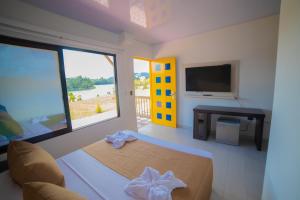 TV a/nebo společenská místnost v ubytování Hotel Aguas Abiertas
