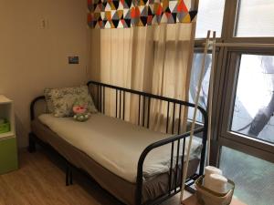 Postel nebo postele na pokoji v ubytování Inside Busan Hostel