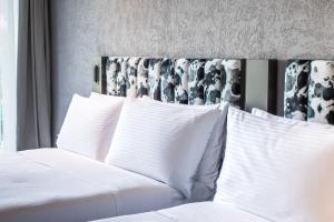 Ein Bett oder Betten in einem Zimmer der Unterkunft Page148, Page Hotels