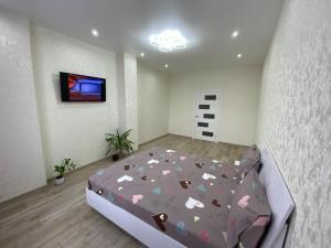 a bedroom with a bed with hearts on it at Люкс апартаменти в ЖКАрена in Rivne