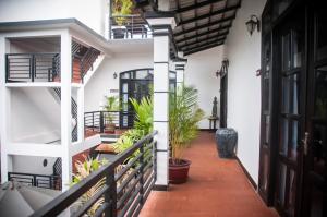 a corridor of a house with plants at Private Boutique Home with Pool, The Fin Inn in Siem Reap