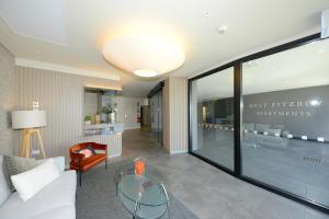 a lobby with a glass table in a room at West Fitzroy Apartments in Christchurch