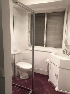 a bathroom with a toilet and a sink at Golden Retreat in Golden Grove