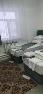 Кровать или кровати в номере Sulo Aksai Hotel
