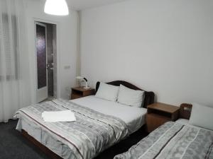 Кровать или кровати в номере Ambient Apartments