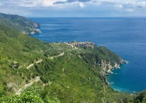 a view of a mountain with the ocean at Infinity view in Vernazza