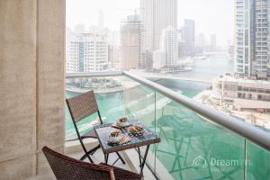 
a table with a laptop on top of it at Dream Inn Apartments - Park Island in Dubai
