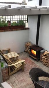 a fire place in a brick building with a brick wall at Kilmore Guesthouse in Kilkenny