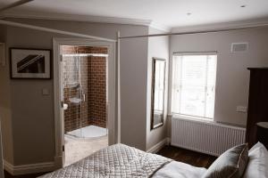 Postel nebo postele na pokoji v ubytování Kilmore Guesthouse