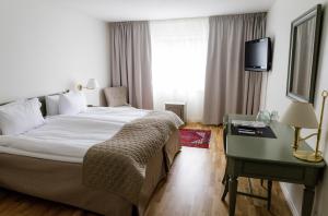 Postel nebo postele na pokoji v ubytování Blommenhof Hotel