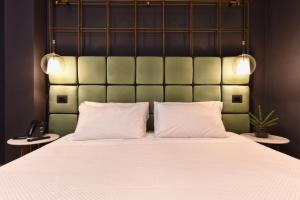Posteľ alebo postele v izbe v ubytovaní Hotel Maison Ducal