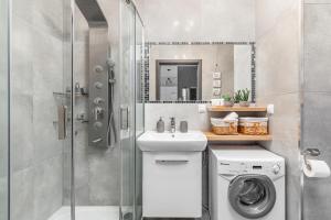 Łazienka w obiekcie Apartamenty Osiedle Bursztynowe III by Noclegi Renters