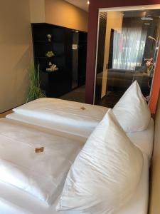 Postel nebo postele na pokoji v ubytování Primetime Hotel
